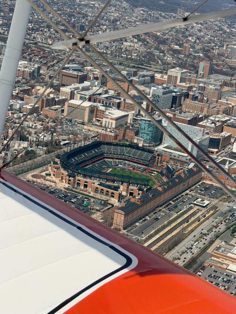 Camden Yards from the biplane towing a banner